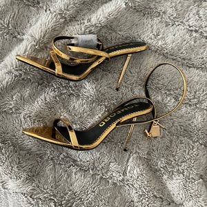 Gold heels with lock never used